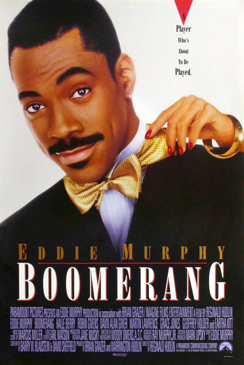 Boomerang movie poster featuring Eddie Murphy wearing a tux and a female hand reaching over his left shoulder pulling at his tie. Above the hand are the words "A Player Who's About To Be Player."