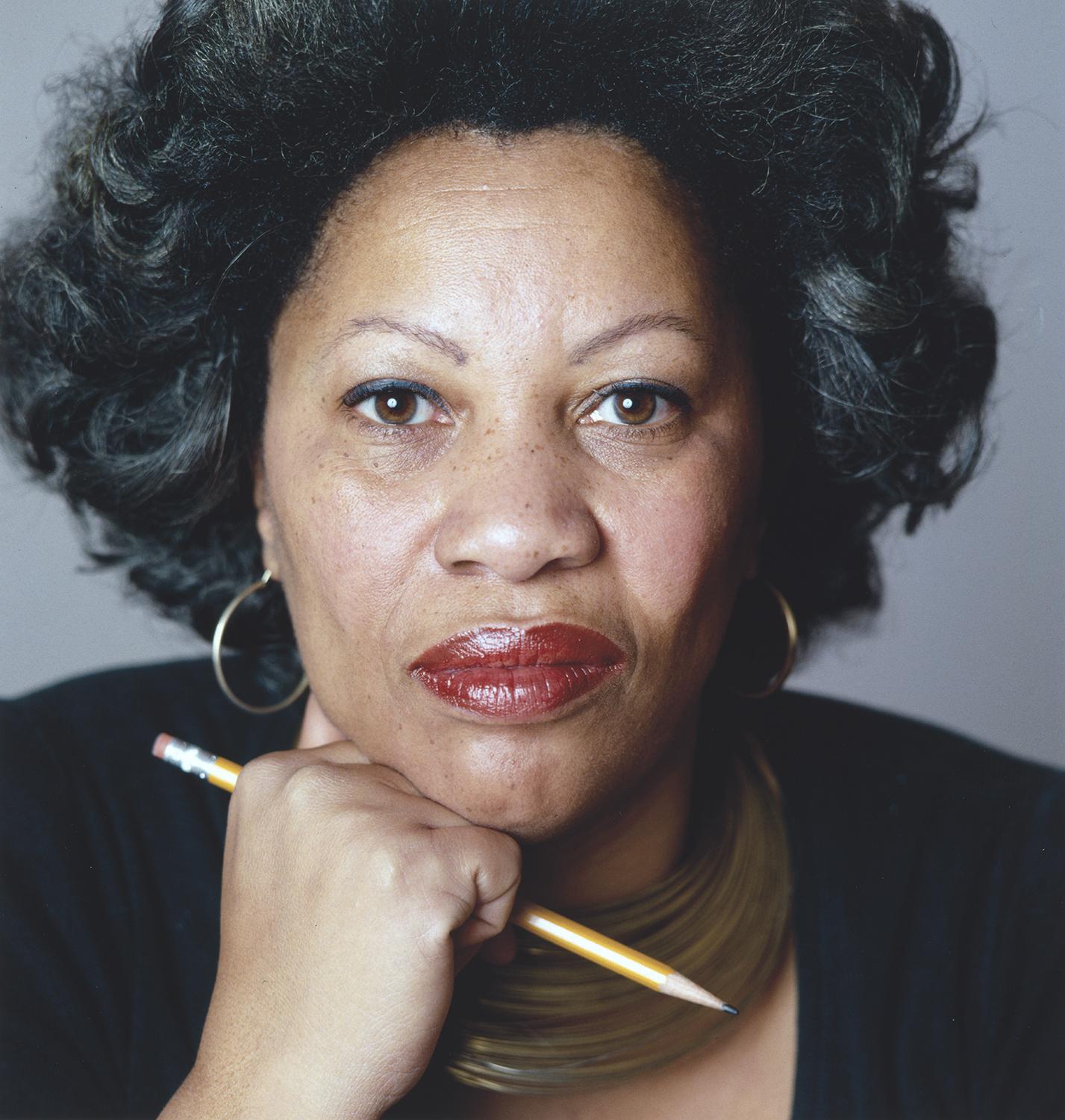 Photograph of Toni Morrison holding a pencil.