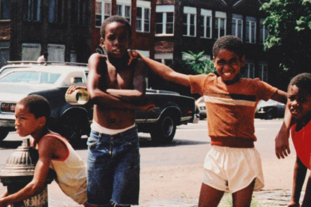 Children playing in front on fire hydrant
