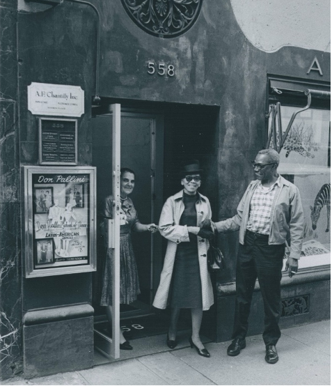 Black and white photo of Florence Cowell and Ann Lowe in front of their shop 