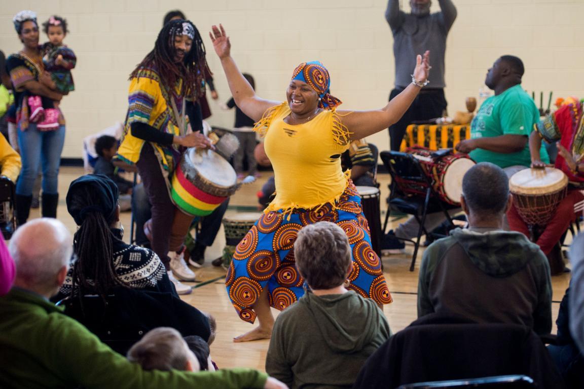 Performers with the African Heritage Dancers and Drummers hold a Kwanzaa celebration hosted by the Smithsonian Anacostia Community Museum at Fort Stanton Recreation Center in Washington, DC, December 27, 2017.