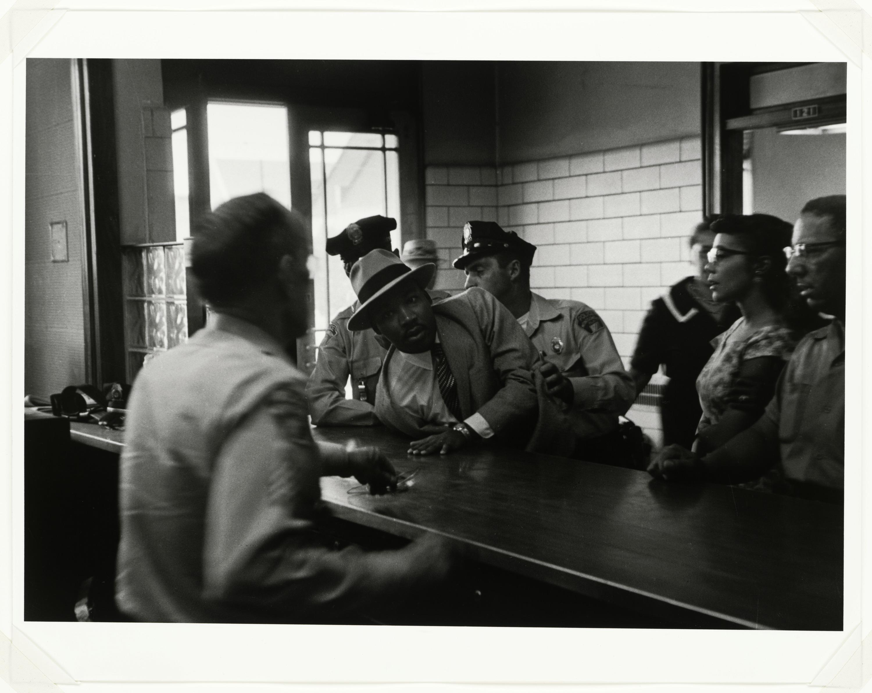 Martin Luther King Jr. is Arrested for Loitering Outside of a Court room Where his Friend Ralph Abernathy is Appearing for a Trial , Montgomery, Alabama