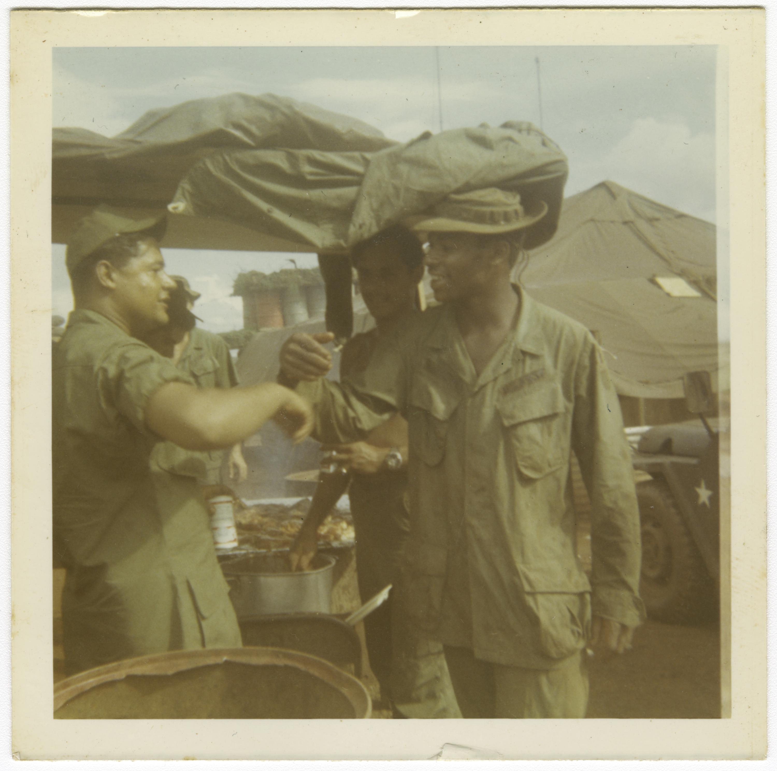 Photograph of American soldiers at a mess tent in Vietnam