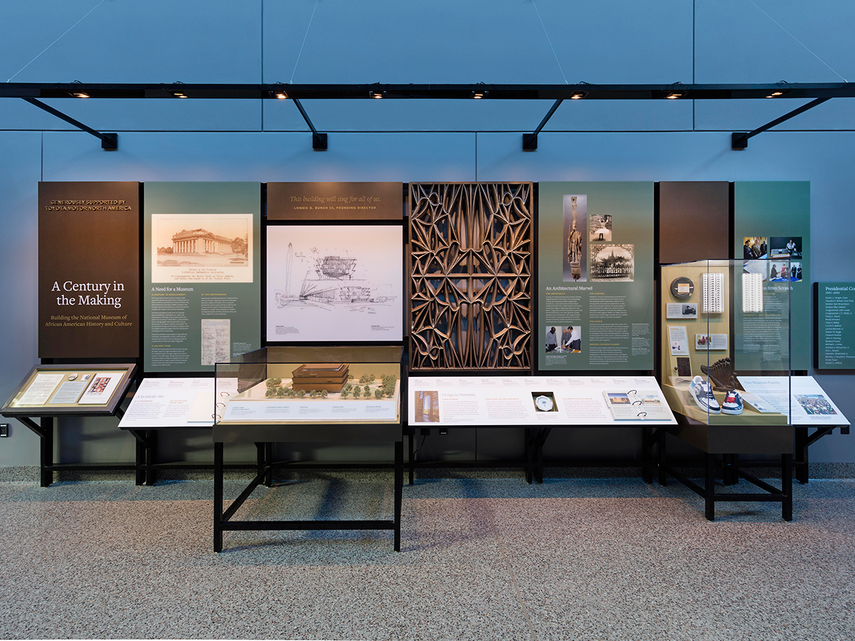 Century in the Making exhibition. Seven panels with artifacts and text about the NMAAHC.