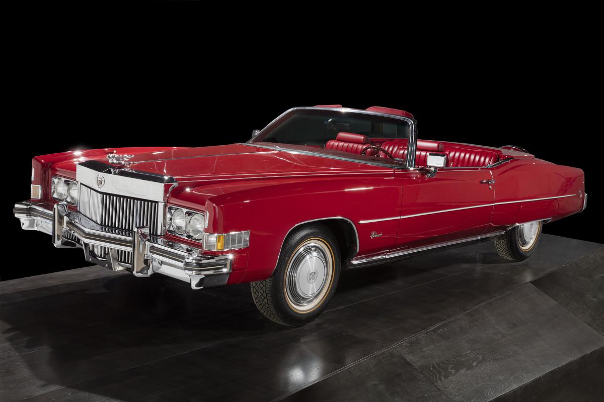 This photograph features Chuck Berry’s candy apple red, 1973 convertible Cadillac El Dorado. This automobile is featured in the Musical Crossroads exhibit at the National Museum of African American History and Culture.