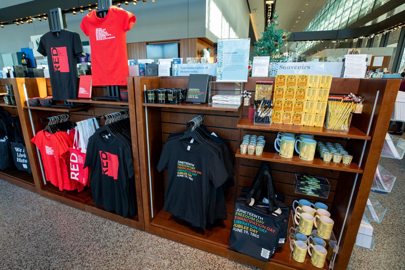 image of a fixture in the museum store containing NMAAHC Juneteenth Merchandise