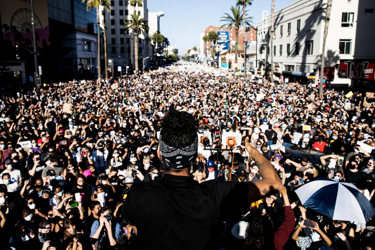 Photograph of Janaya Khan speaking to a crowd during a BLM protest in Hollywood.