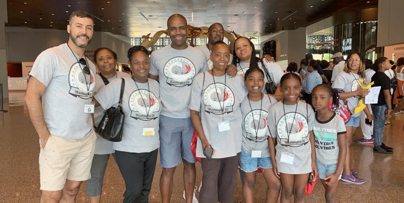 A family wearing family reunion t-shirts at the National Museum of African American History and Culture