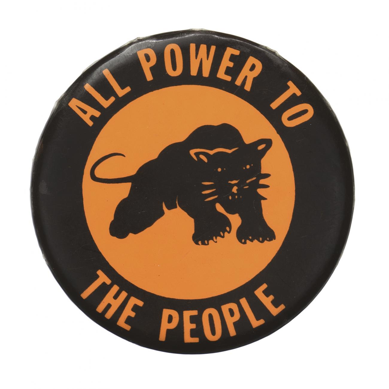 A round button with orange text and a black panther image