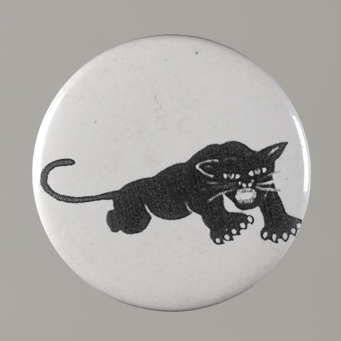 A white button with an image of a black panther