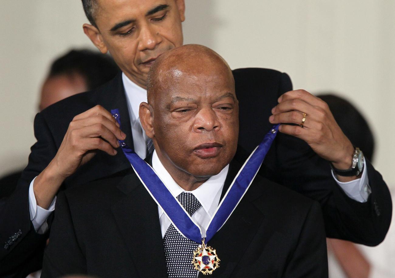 Rep. John Lewis (D-GA) (R) is presented with the 2010 Medal of Freedom by President Barack Obama during an East Room event at the White House February 15, 2011 in Washington, DC. Obama presented the medal, the highest honor awarded to civilians, to twelve pioneers in sports, labor, politics and arts.