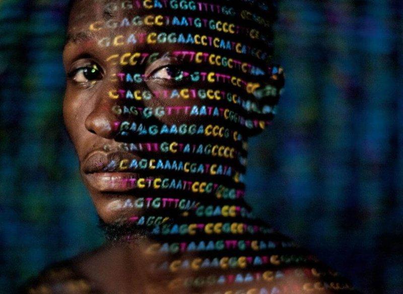 Image of African American head with digits from a computer screen on his face