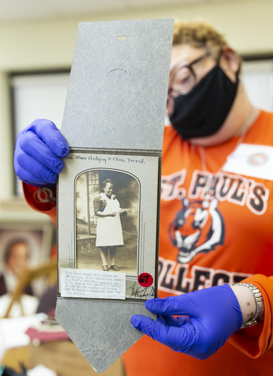 A person holding a photograph
