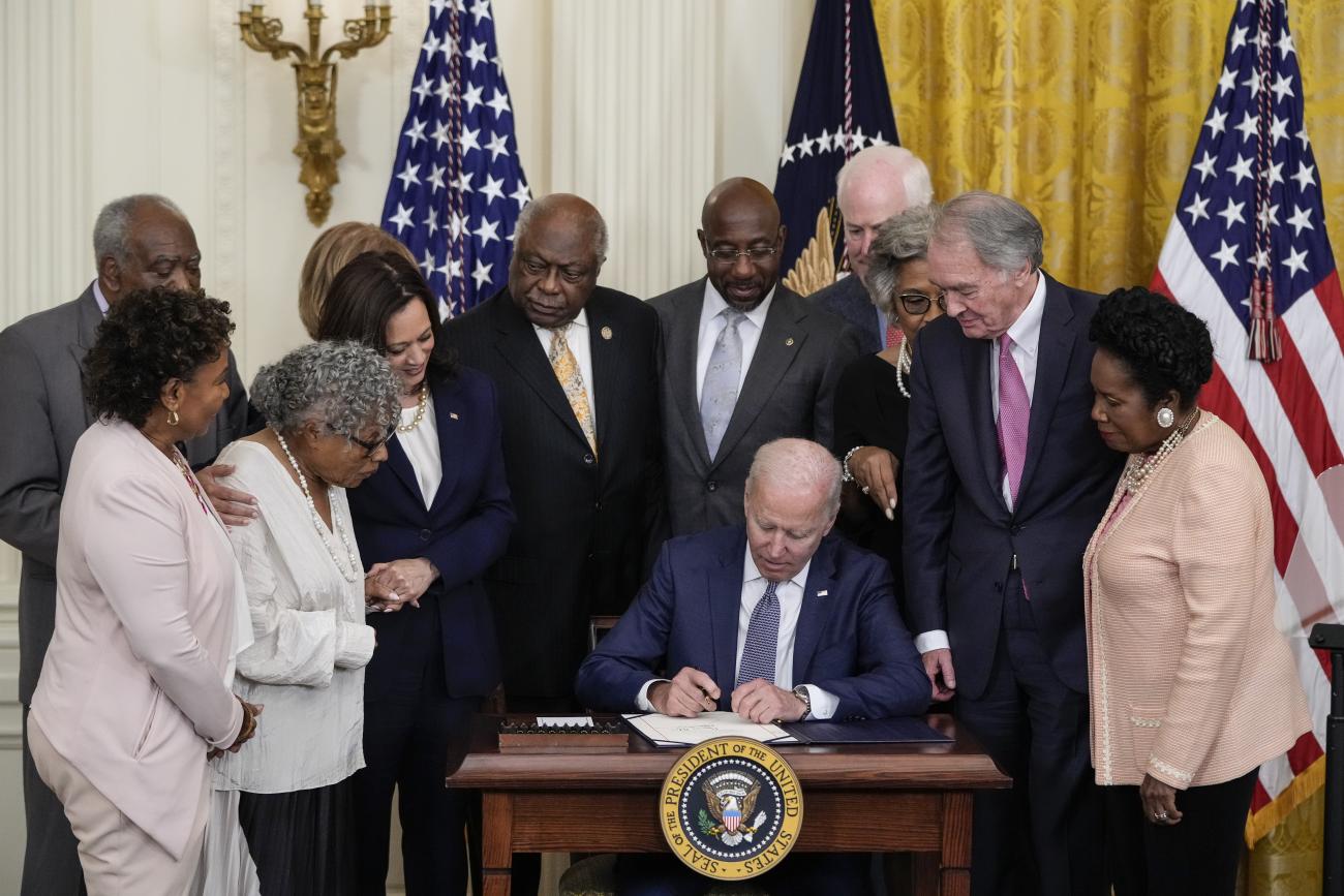 U.S. President Joe Biden signs the Juneteenth National Independence Day Act into law in the East Room of the White House on June 17, 2021 in Washington, DC. The Juneteenth holiday marks the end of slavery in the United States and the Juneteenth National Independence Day will become the 12th legal federal holiday — the first new one since Martin Luther King Jr. Day was signed into law in 1983.