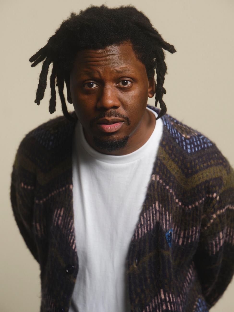Headshot image of DJ Cuzzin B