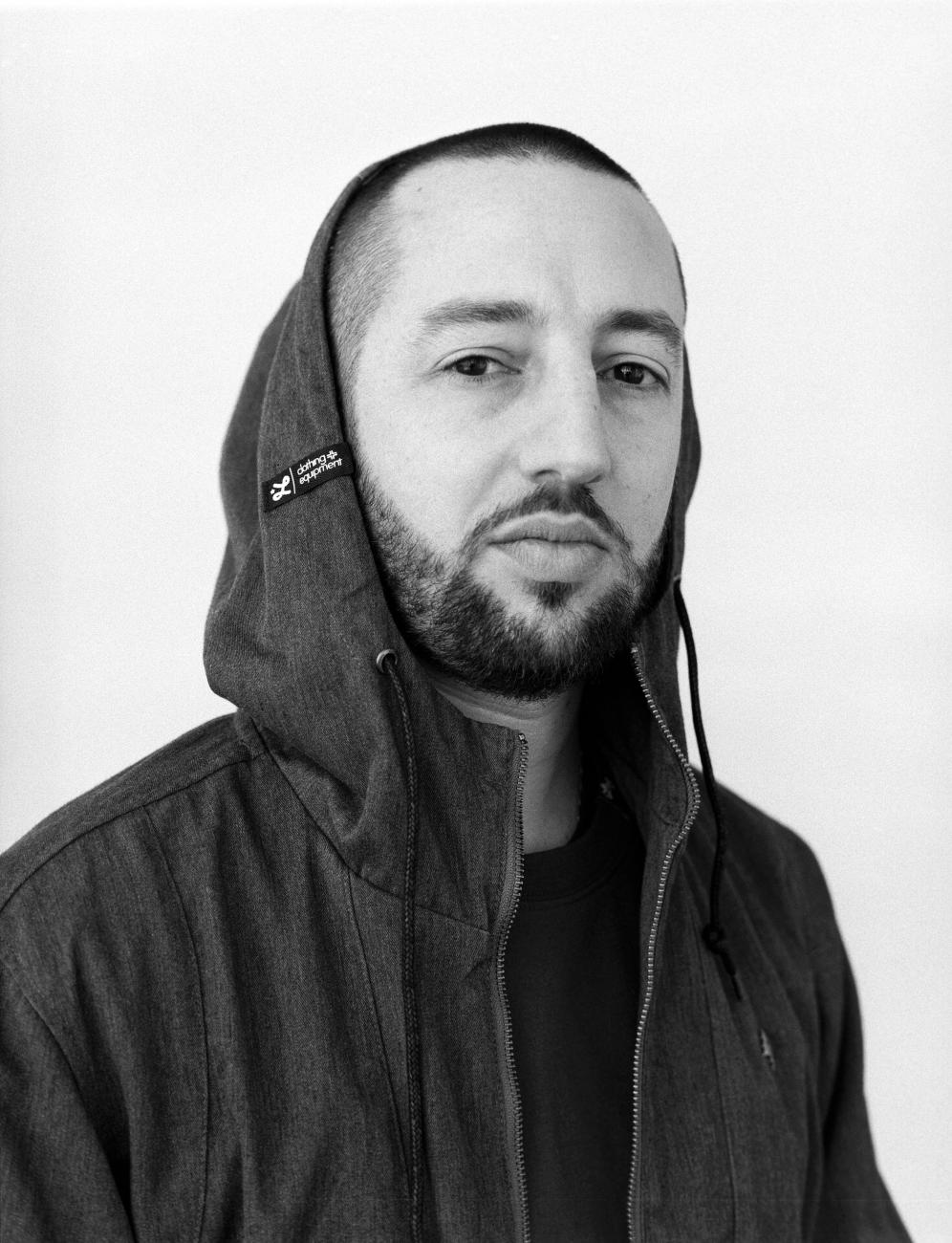 Black and White headshot of J.Period