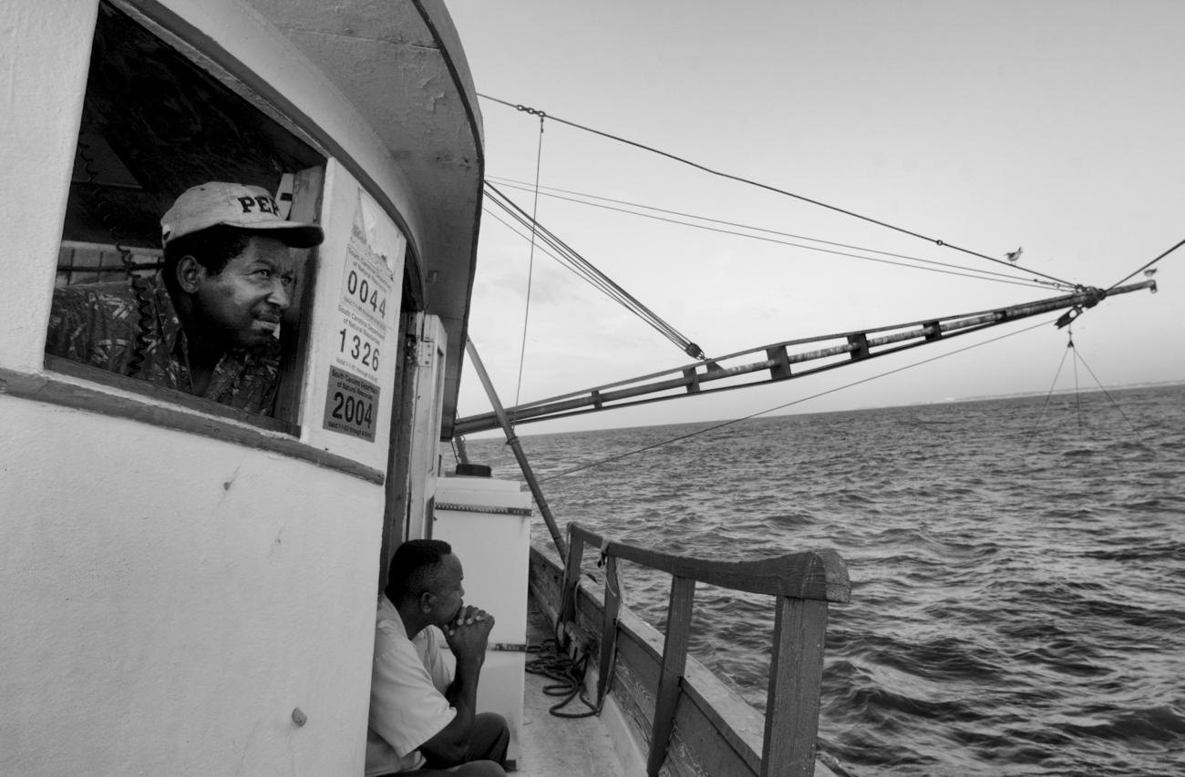 Two men on a shrimp boat