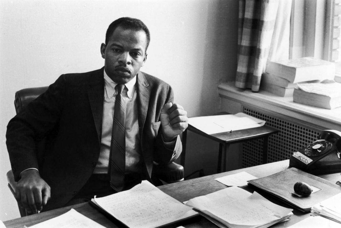 Political leader John Lewis sitting.