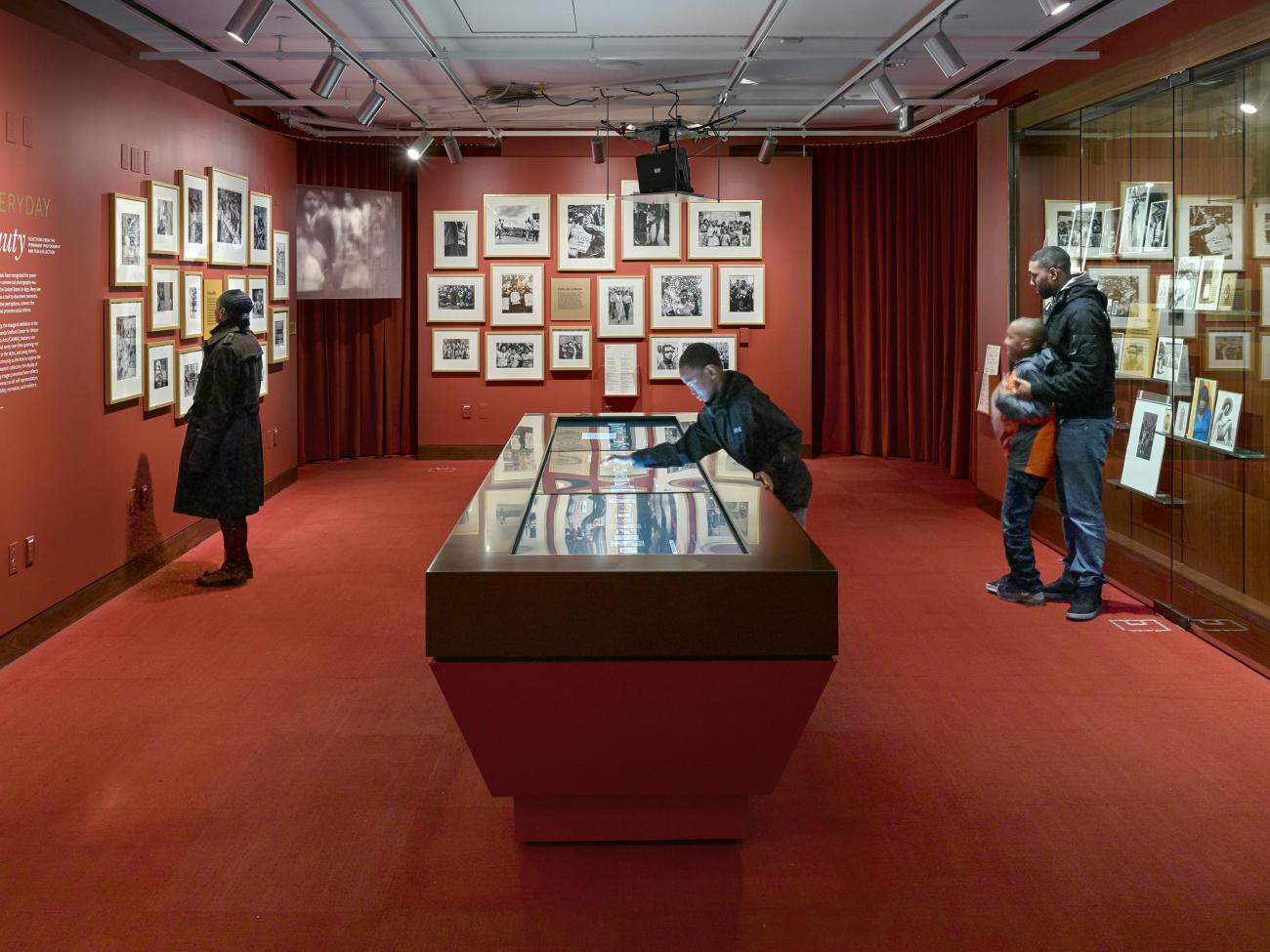 Image of visitors in a gallery looking at objects