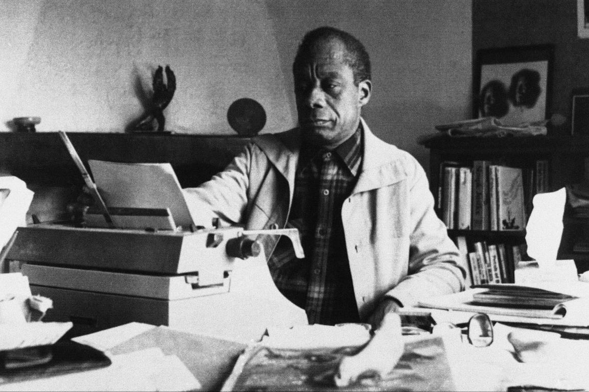 James Baldwin working at his desk in St. Paul de Vence