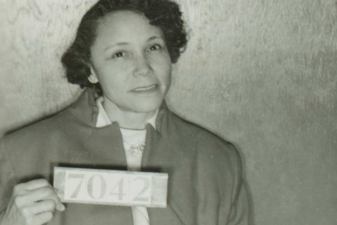 Mugshot of Jo Ann Robinson with a sign reading 7042.