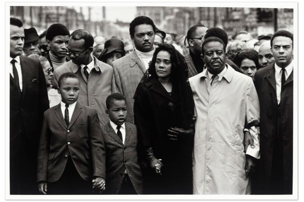 A group of family and friends of Martin Luther King, Jr., including Coretta Scott King, Harry Belafonte Jr. and Jesse Jackson, holding hands at his funeral services in Memphis, 1968. 