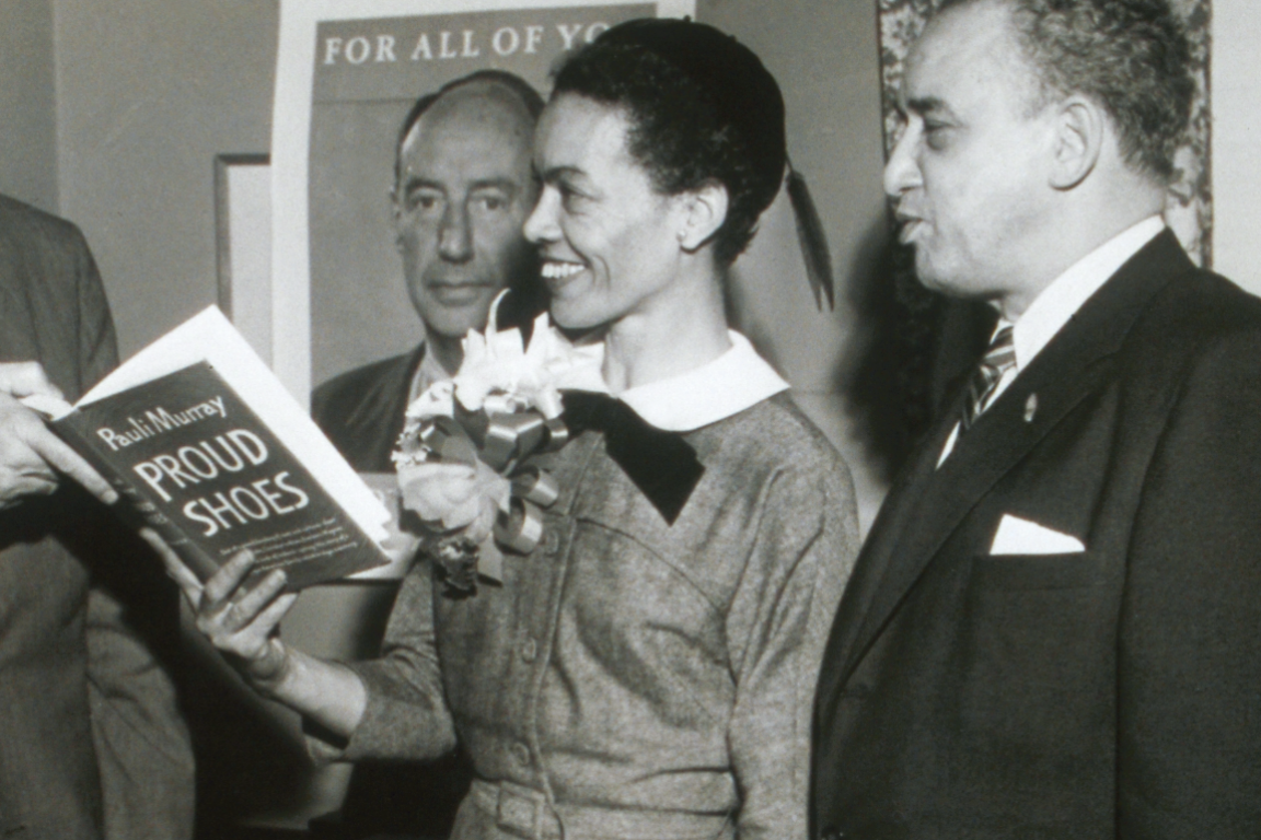 Pauli Murray holding a copy of "Proud Shoes" in 1956