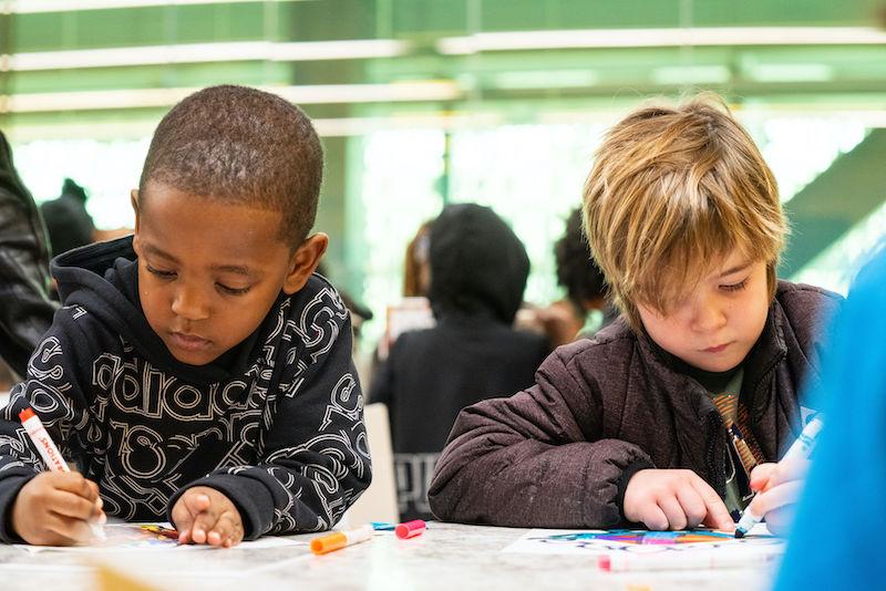Two young children participating in an early childhood education program