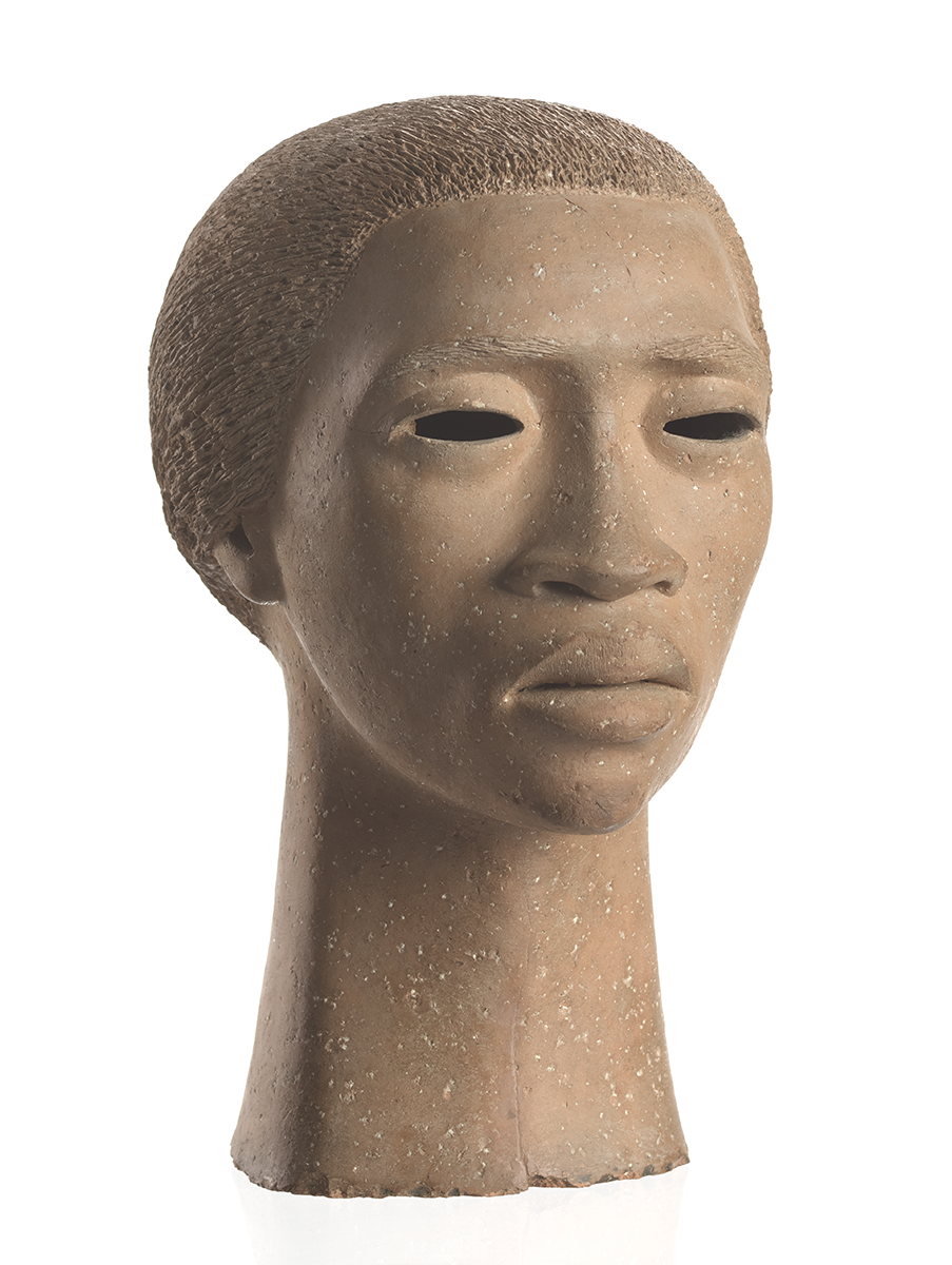 A terracotta sculpture depicts the head and neck of a young woman.