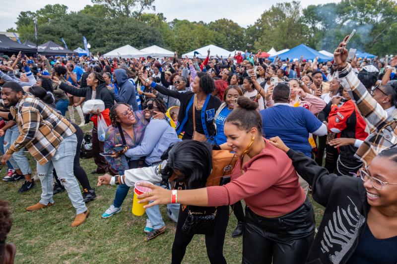 Students on the yard of Hampton university enjoying music