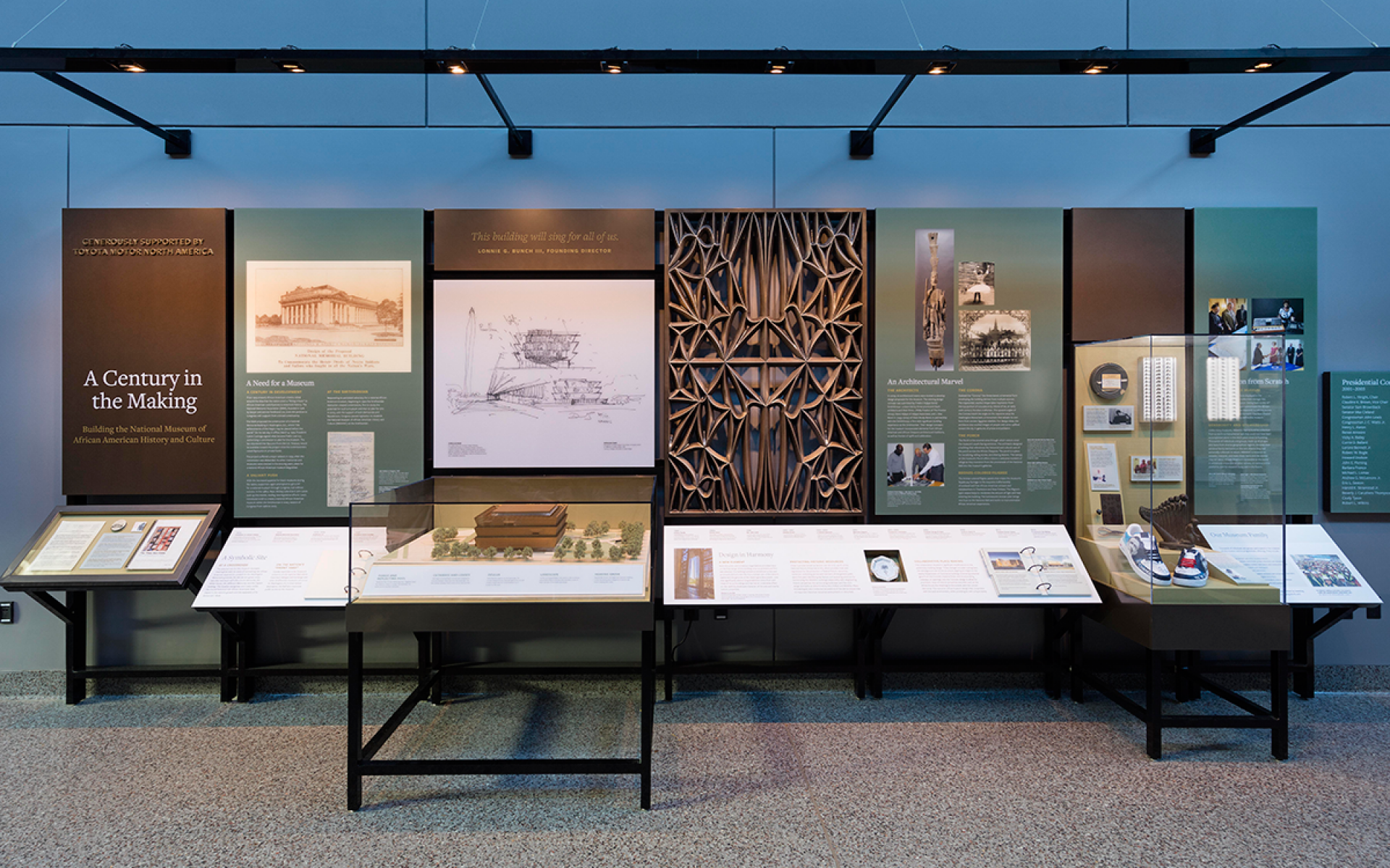 Century in the Making exhibition. Seven panels with artifacts and text about the NMAAHC.