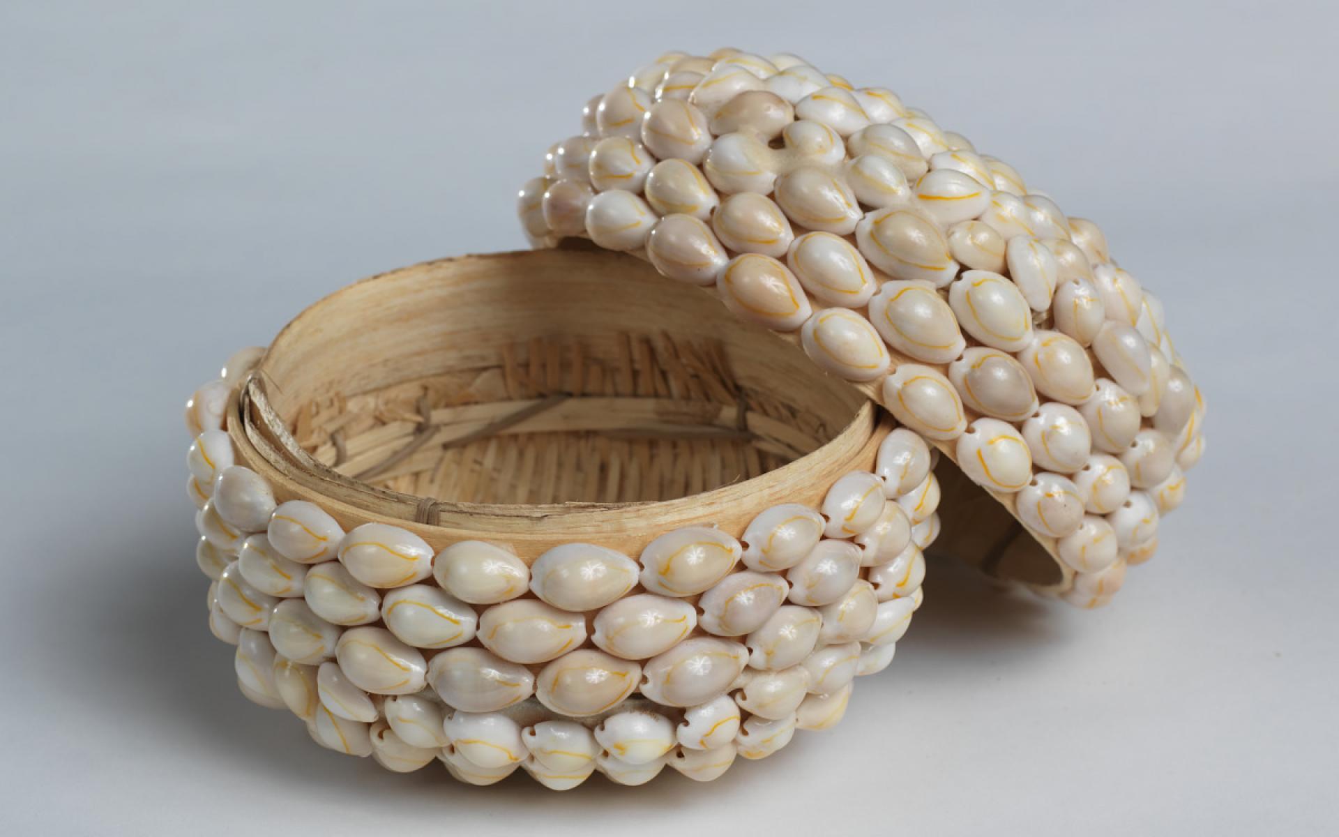 A cowrie shell basket created by artisans in Mossuril, Mozambique, in 2015 to hold soil from the region, which was then deposited at the site of the São José shipwreck.