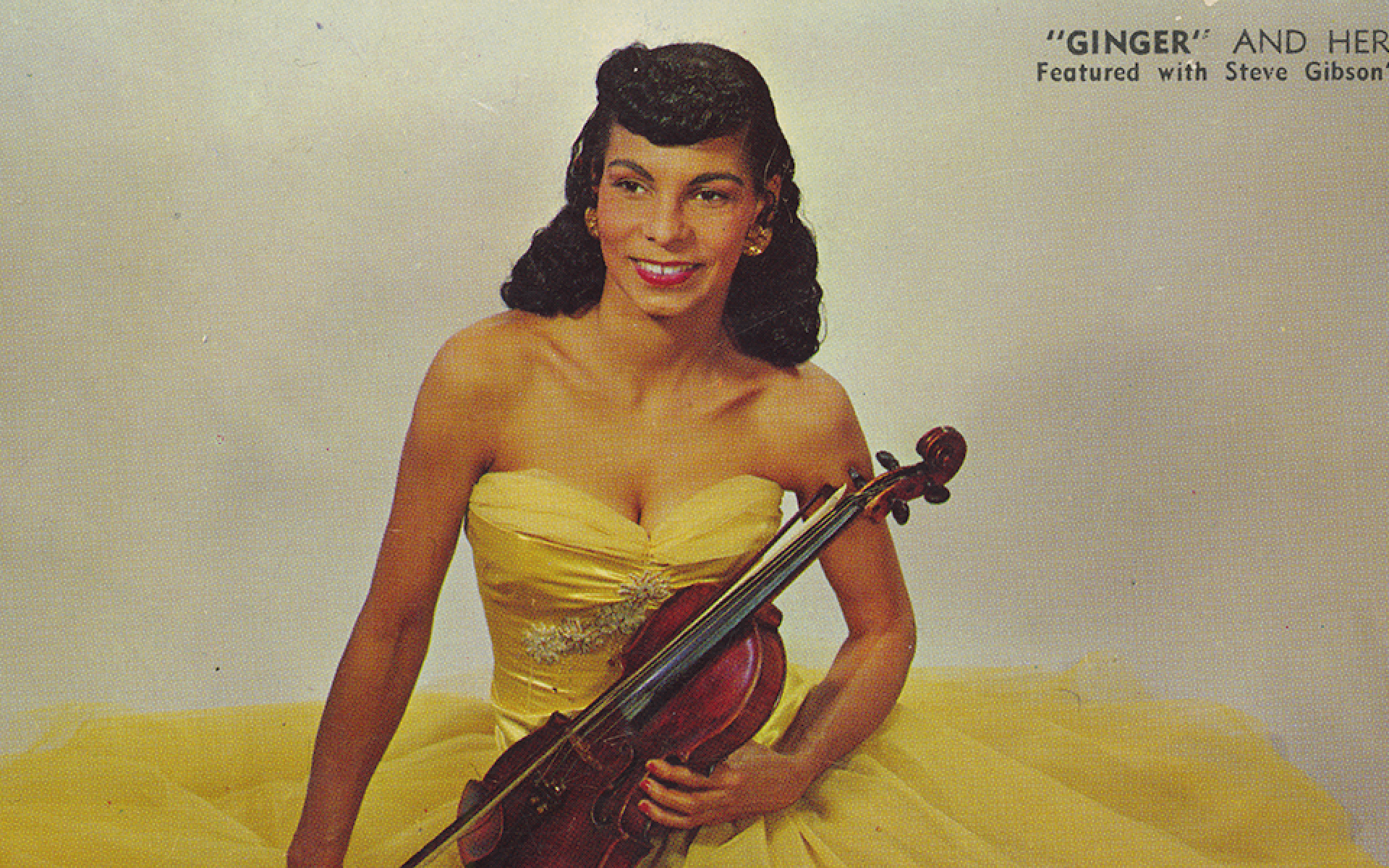 An image of Ginger Smock wearing a yellow dress holding a violin.